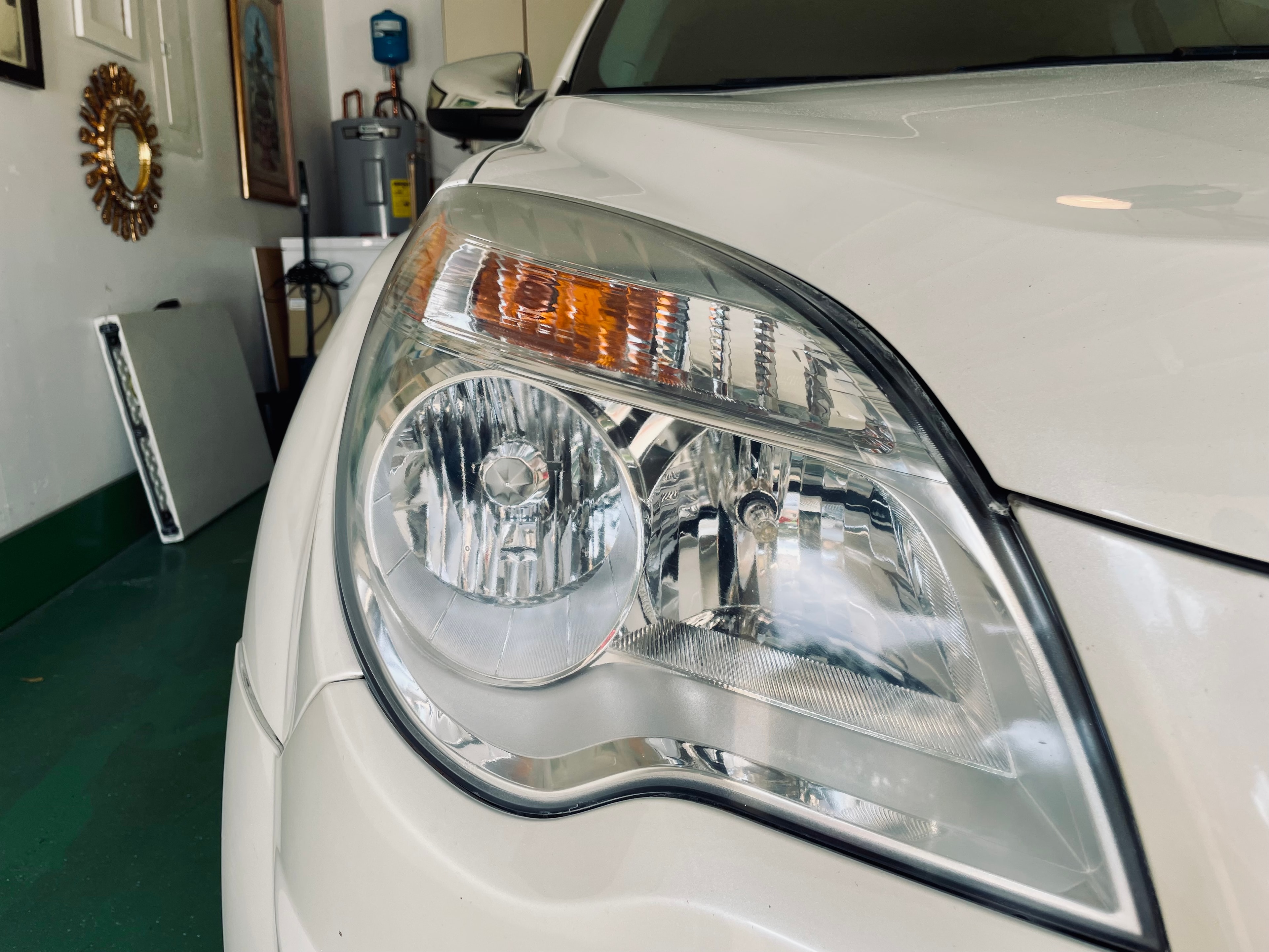 Clear restored headlight on white vehicle after restoration