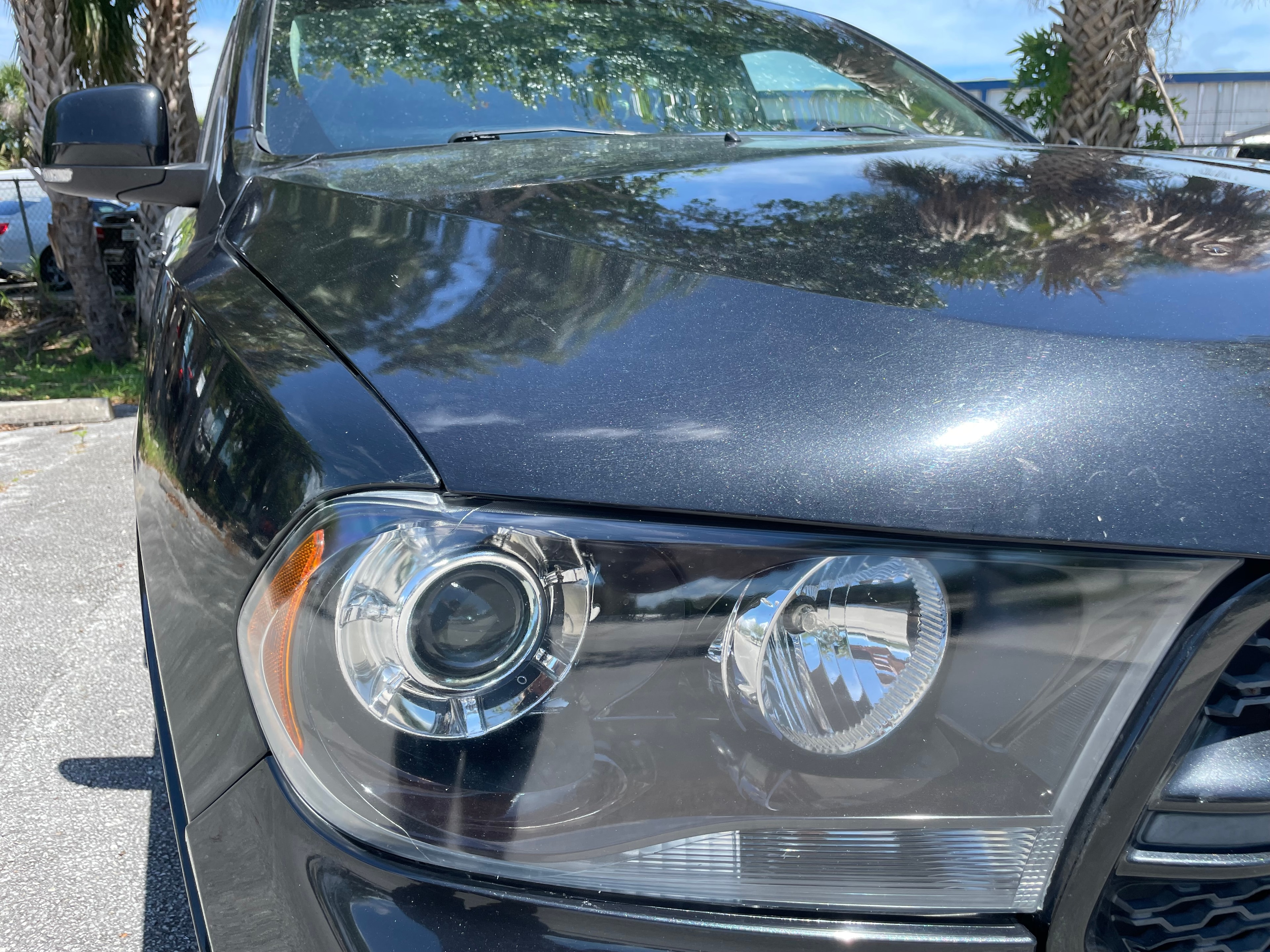 Clear restored headlight on dark Dodge after restoration